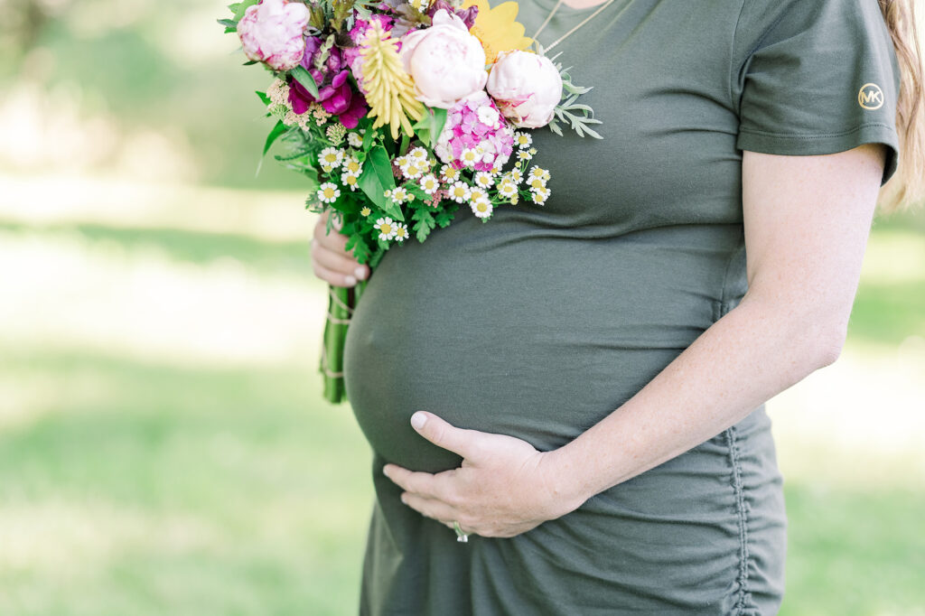 baby bump and fresh flowers