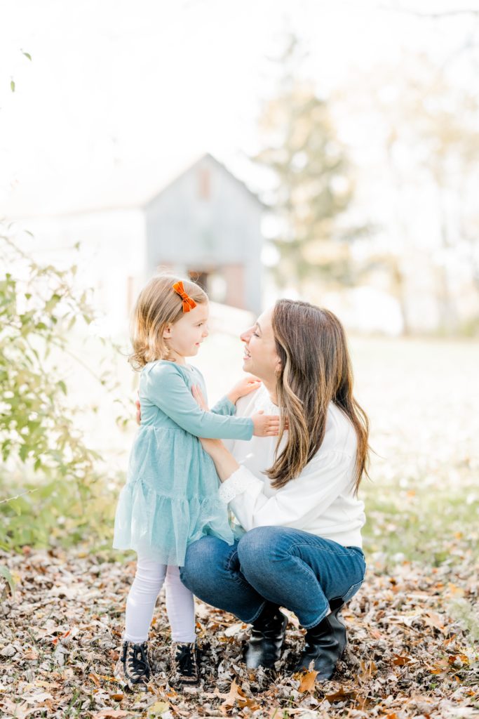 little girl and mom at family session with Golden Heart Photography