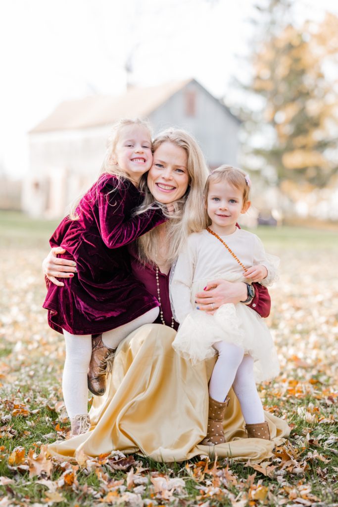mom poses with daughters at Holiday Mini Session | Five Birds Farm Ringoes | The Munz Family | Golden Heart Photography