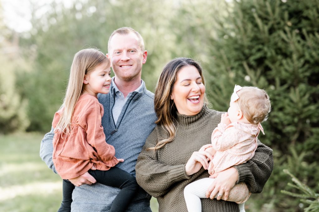 family of four laughs at Holiday Mini Session | Hunterdon County Mini Sessions | The Furstenburg Family | Golden Heart Photography