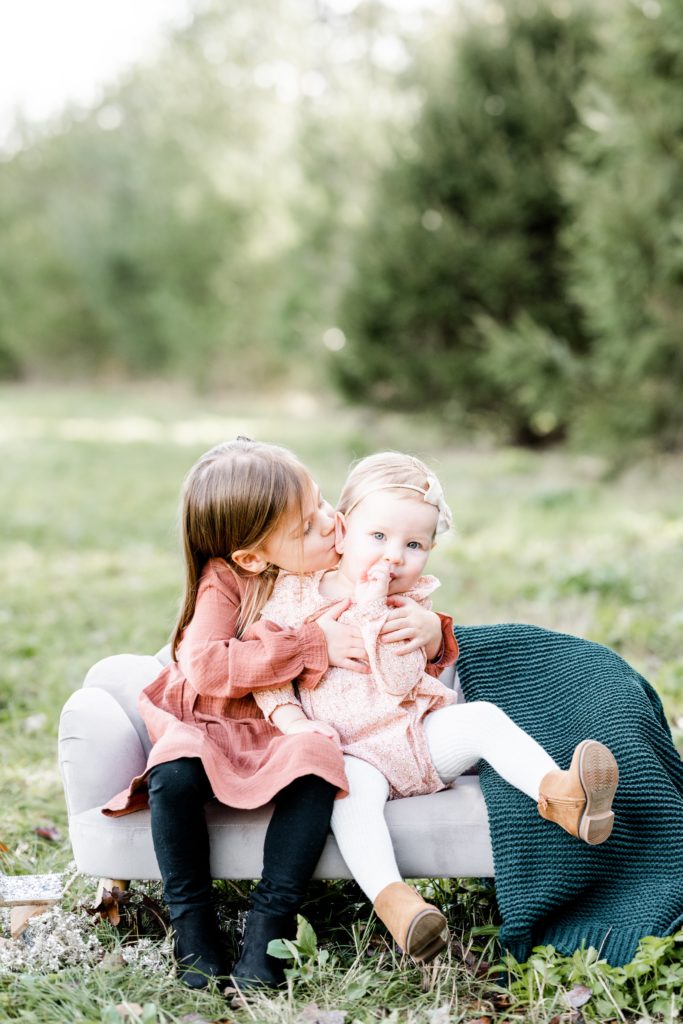 big kisses from big sister at Golden Heart Photography family session