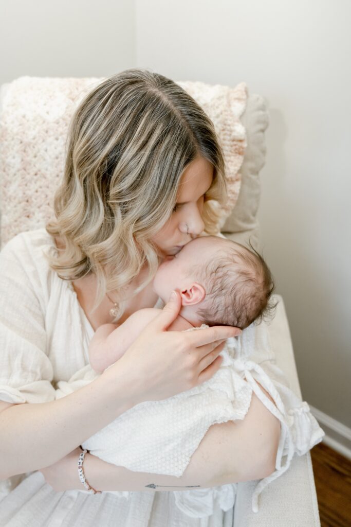 Sweet kisses from mama for baby The Clark Family | Family Newborn Photoshoot | Golden Heart Photography